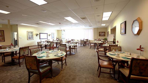 A spacious dining area with neatly arranged tables and chairs, providing a welcoming atmosphere.