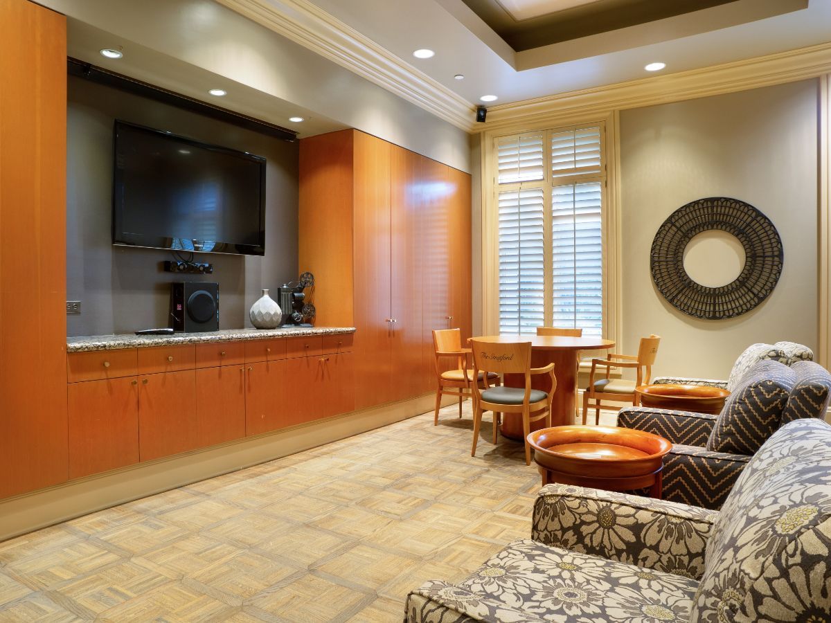 A modern living room with a television, comfortable seating, and stylish decor.
