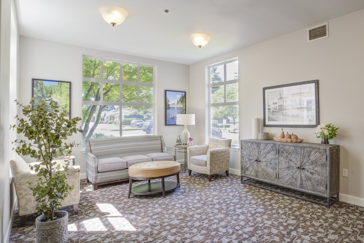 A bright and inviting living room with modern furniture and ample natural light.