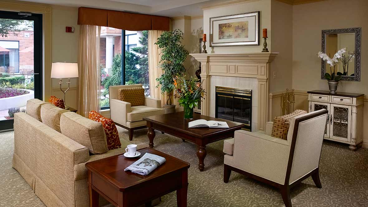 A cozy living room with elegant furniture and a fireplace.