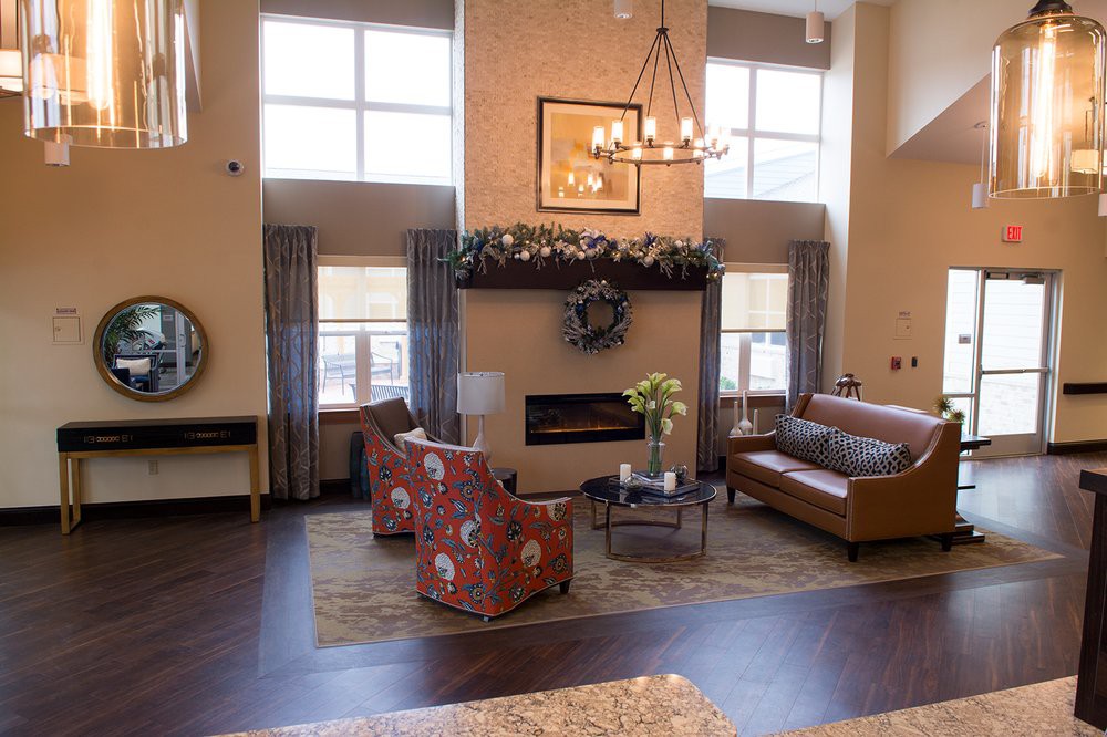 A cozy living room with elegant furniture and a fireplace.