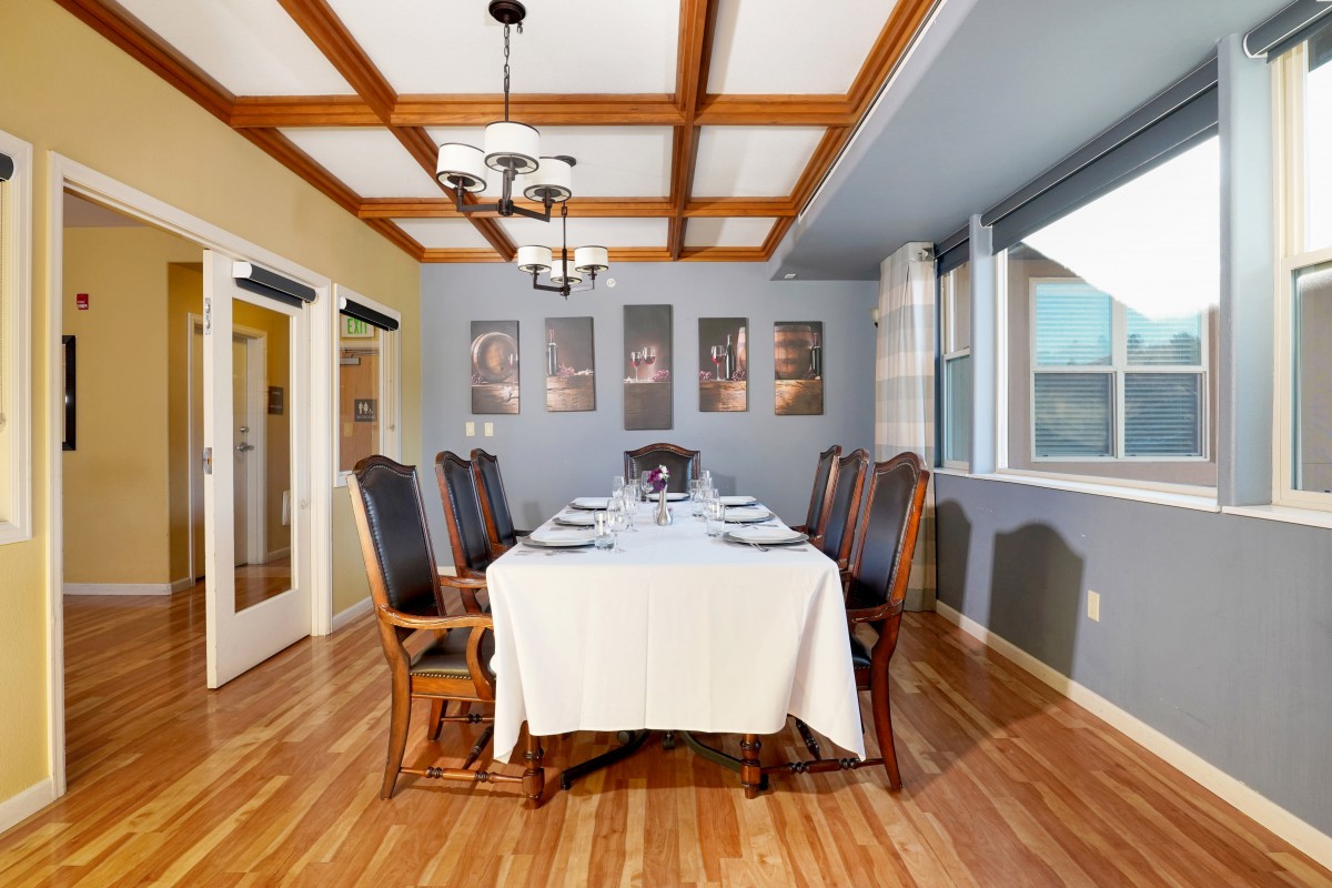 Elegant dining room with a set table and classic decor.