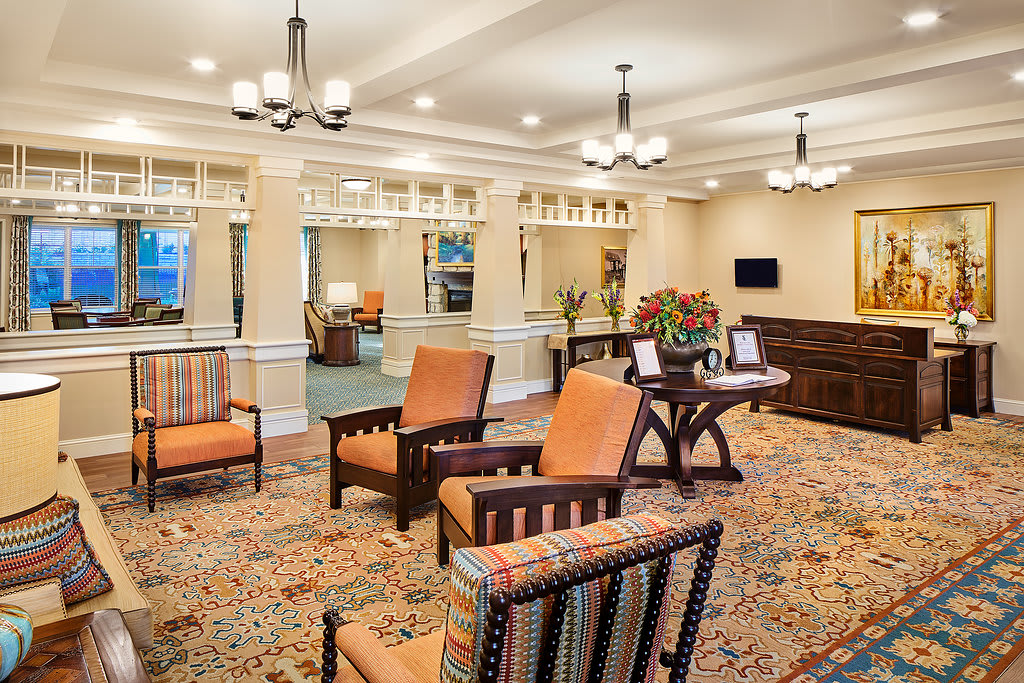 A well-furnished lobby area with comfortable seating and elegant lighting.