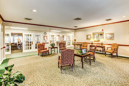 A well-lit lobby area with comfortable seating and elegant decor.