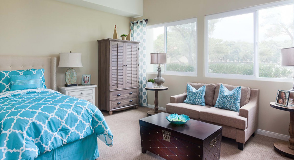 A bright and modern bedroom with stylish furnishings and ample natural light.