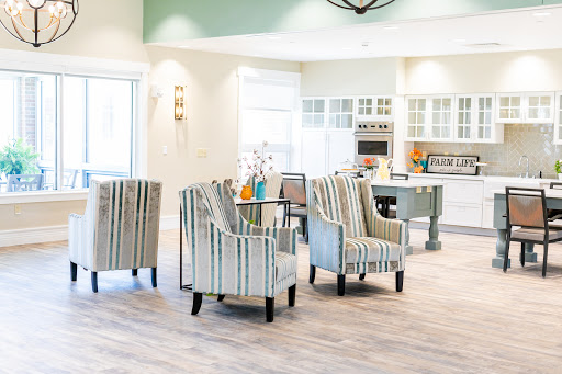 A bright and modern living space featuring stylish striped chairs and a cozy atmosphere.