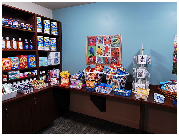 A small store display featuring a variety of snacks and convenience items.