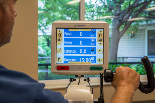 A rehabilitation monitor displaying vital statistics during a patient's exercise session.