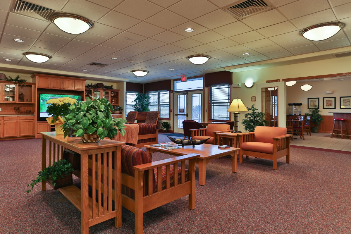 A cozy lobby with comfortable seating and warm lighting.