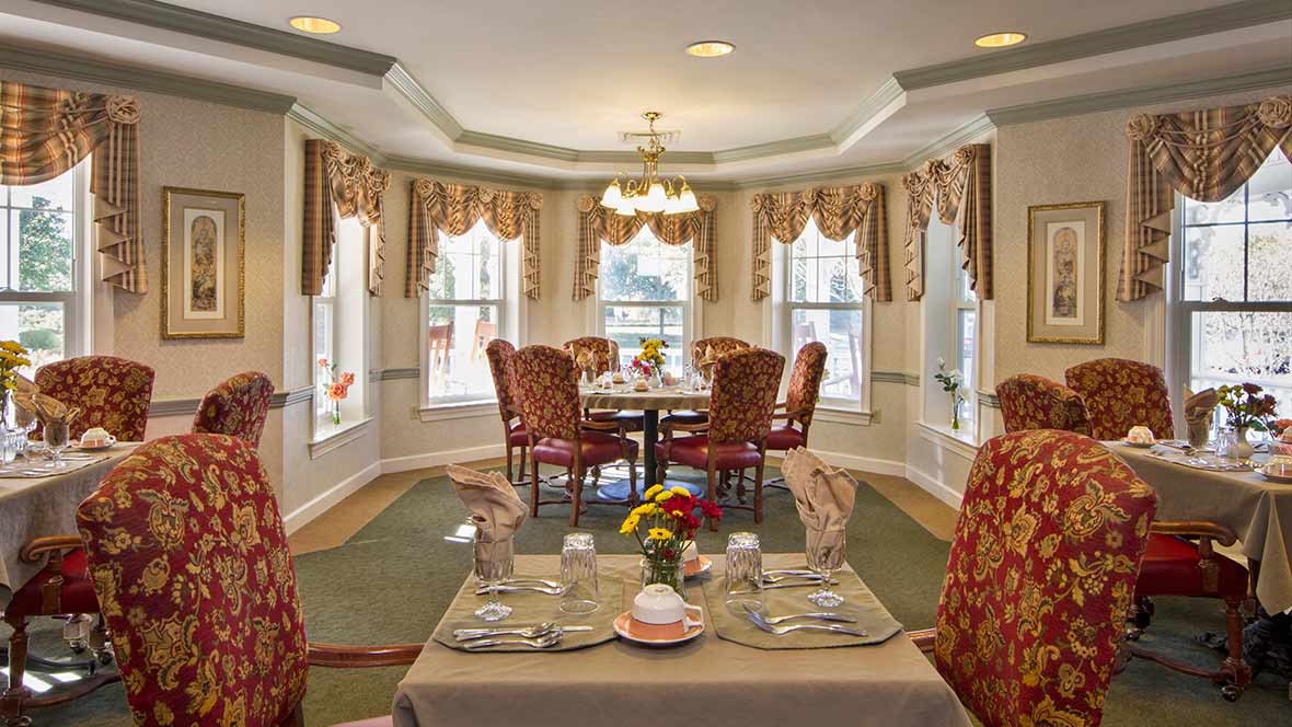 Elegant dining room with a beautifully set table and classic decor.