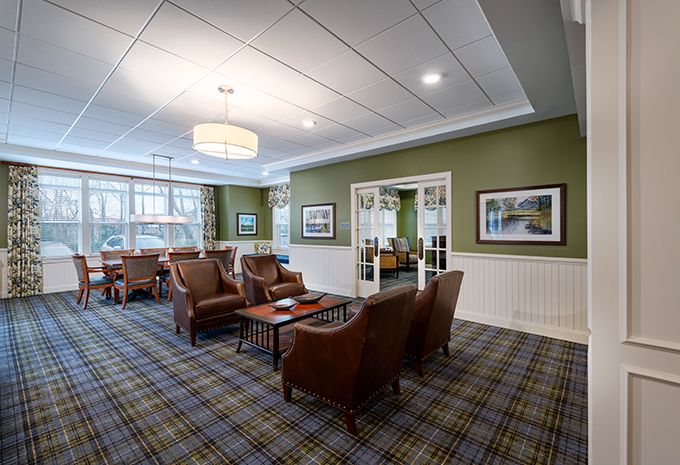 A cozy lounge area with armchairs and traditional decor.