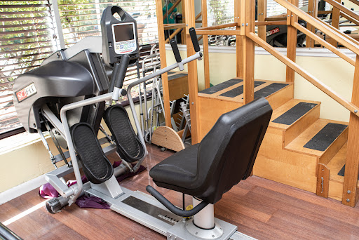 An elliptical machine situated in a gym, ready for a workout session.