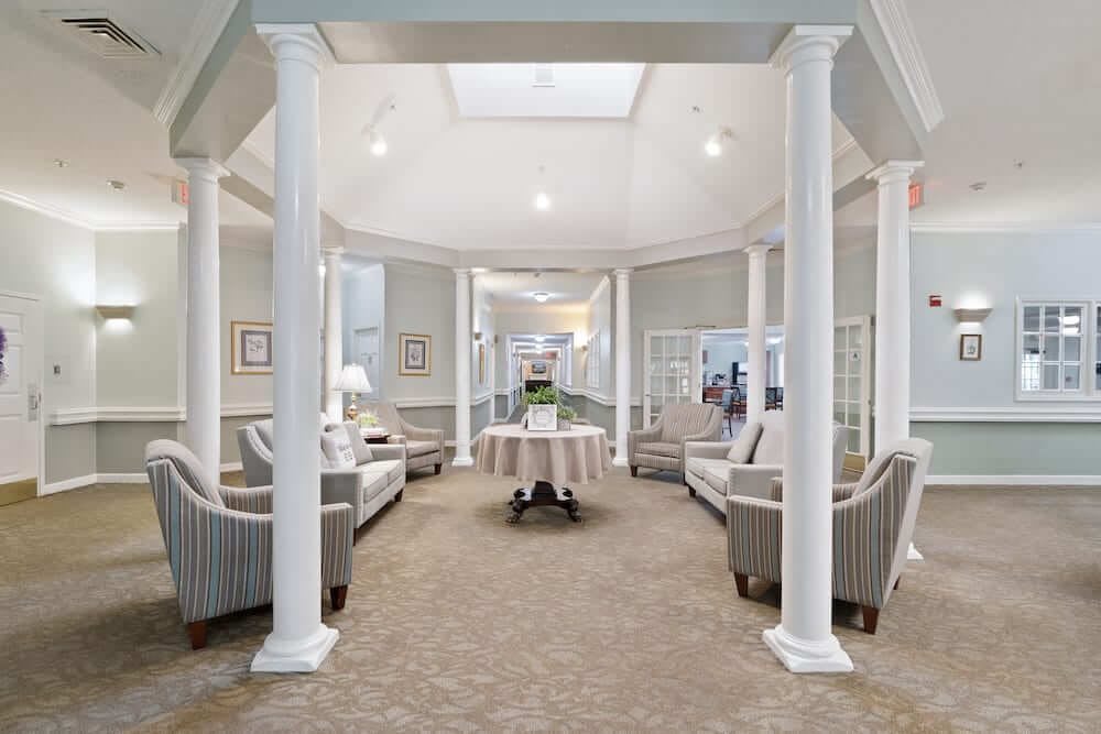 A modern lobby area with elegant seating and architectural columns.