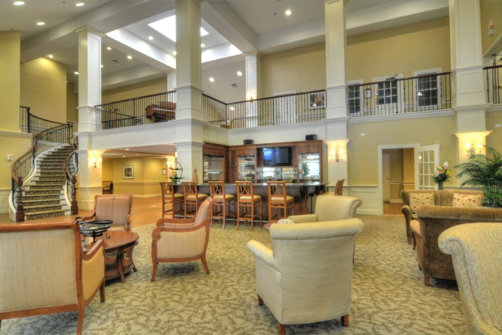 A spacious lobby area featuring comfortable seating and elegant lighting.