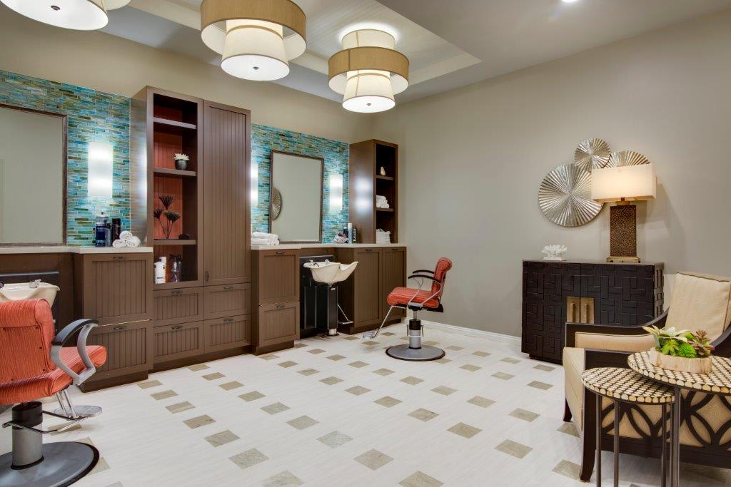 A modern salon interior with a stylish hair stylist station and elegant decor.