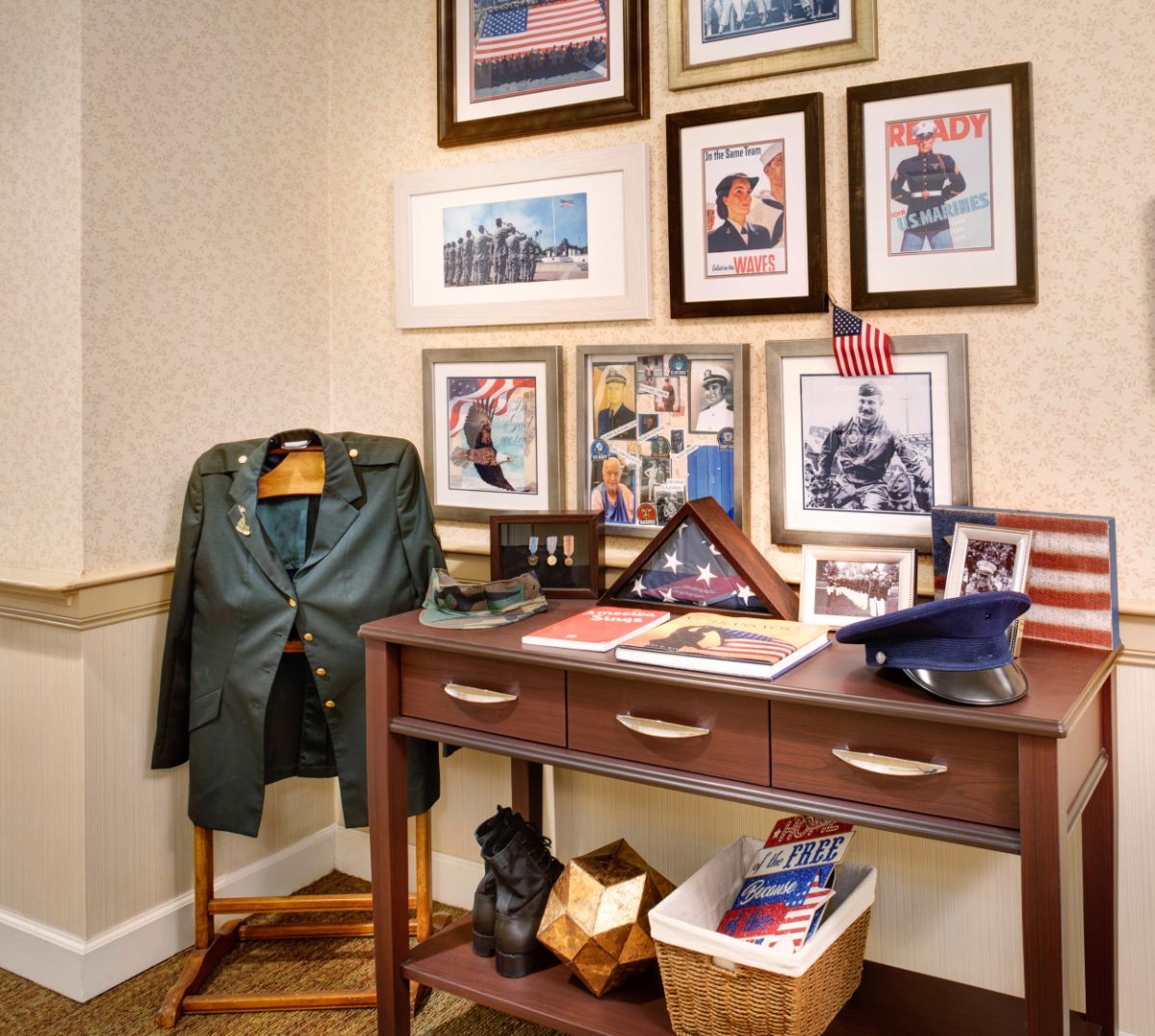 A room corner features a military uniform on a stand and a collection of framed photos and magazine covers, showcasing military memorabilia and decorations.