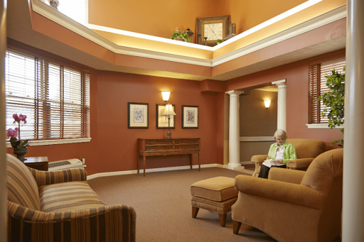 A cozy lounge area featuring warm tones and comfortable seating, perfect for relaxation.