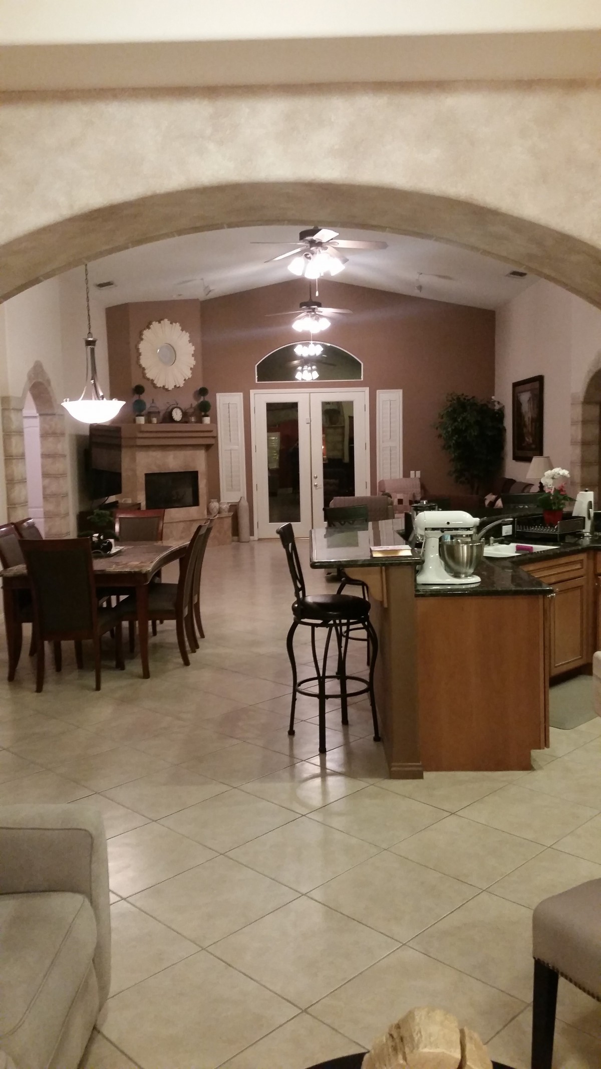 A spacious open-floor kitchen and dining area with modern furnishings.
