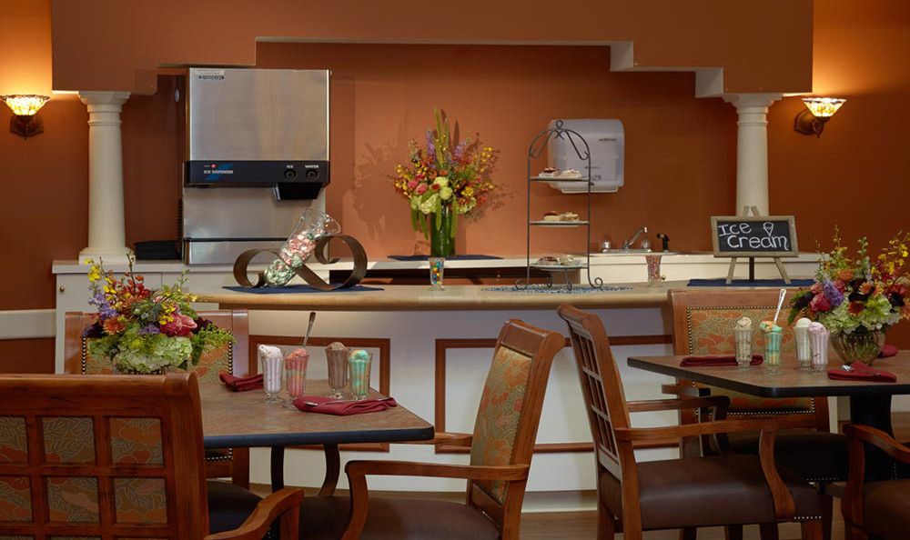 Cozy dining area with a warm color palette and floral centerpiece.