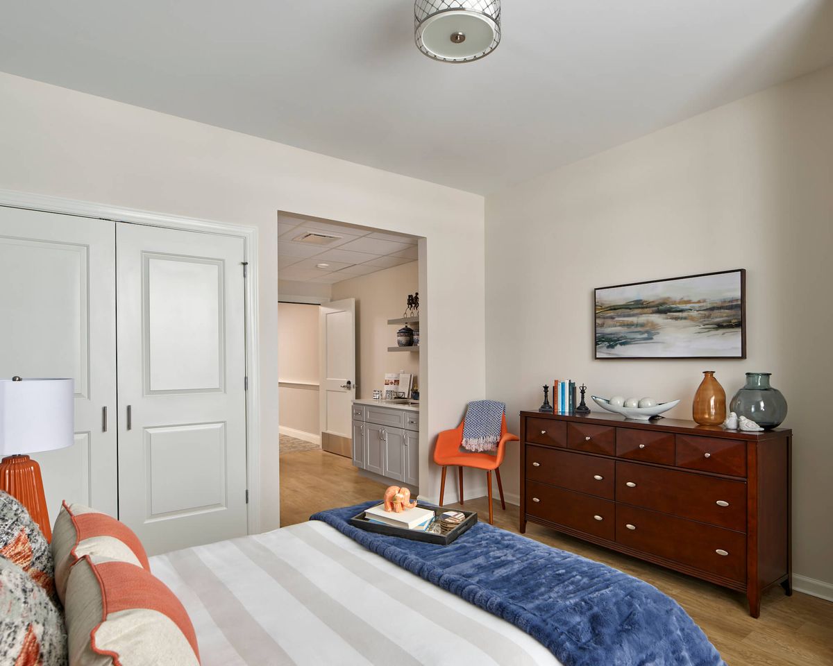 Cozy bedroom with stylish furniture and decor.