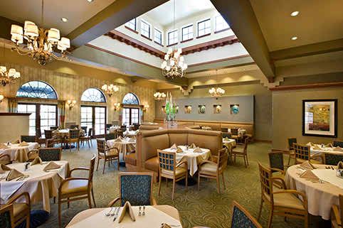 An elegant restaurant interior with a spacious dining area and stylish decor.