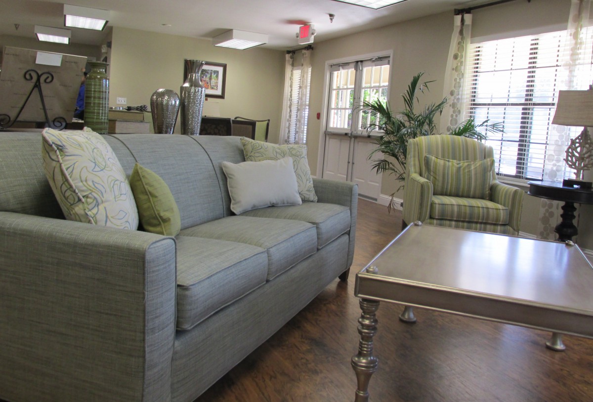 A cozy living room with a comfortable sofa and armchair, complemented by stylish decor.