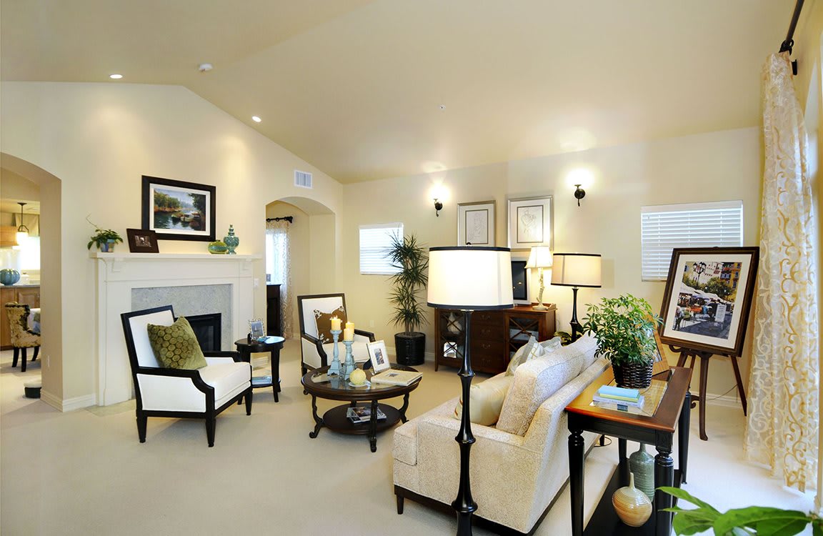 A beautifully decorated living room with elegant furniture and soft lighting.