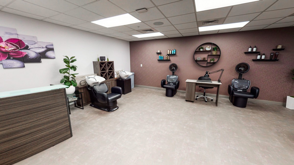 A cozy salon interior with comfortable chairs and modern decor.