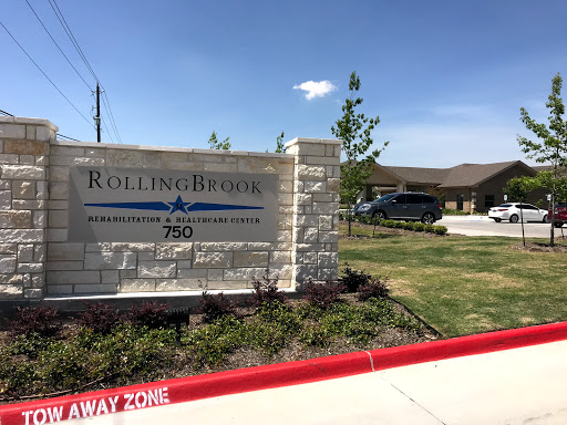 Entrance sign of Rolling Ridge, showcasing a welcoming exterior in a sunny environment.