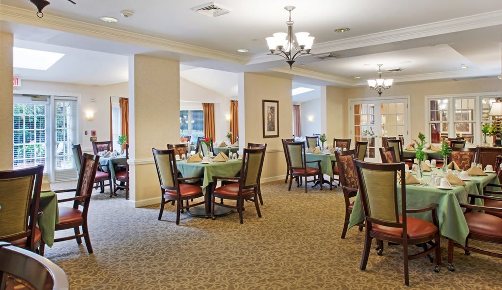 Elegant dining area with tables set for service.