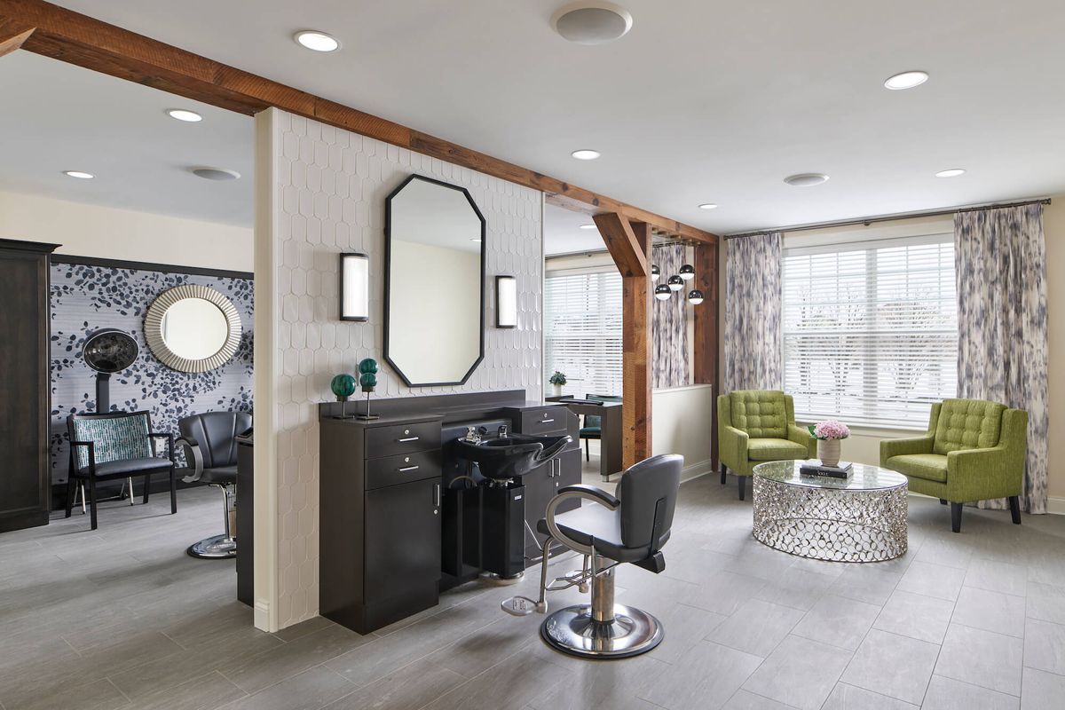 A modern hair salon interior with stylish furniture and decor.