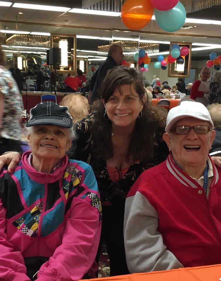 A cheerful group enjoying a family gathering in a vibrant setting.