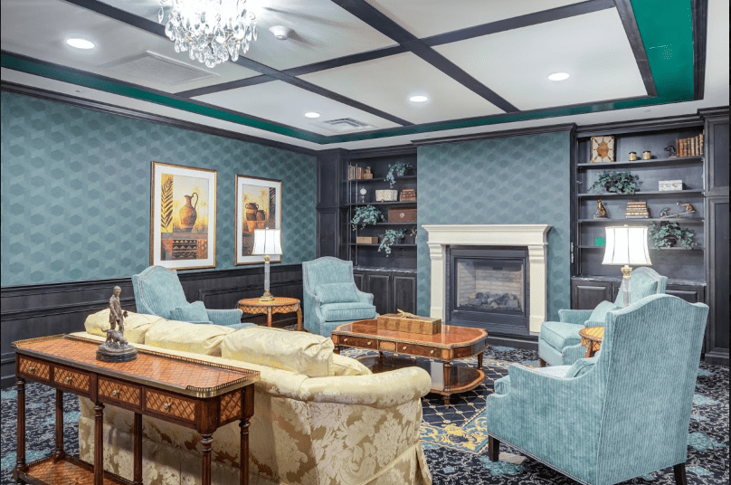 Cozy living room with elegant furnishings and a warm fireplace.