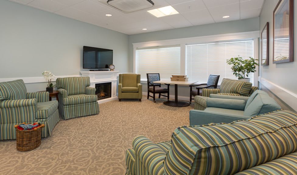 A cozy living room with comfortable seating and a television.
