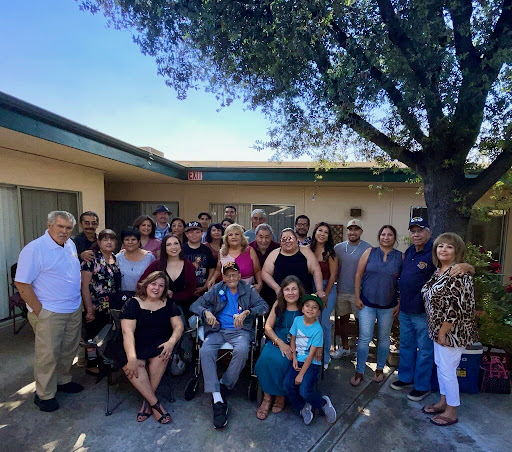A joyful family gathering under the sun, creating lasting memories together.
