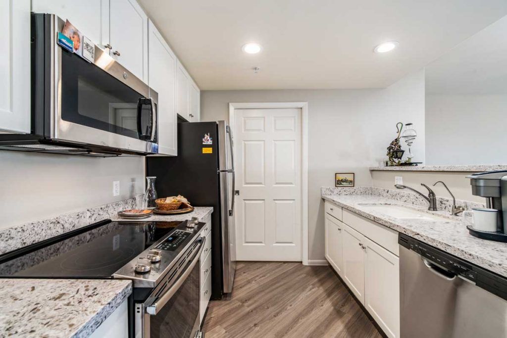 A modern kitchen with sleek appliances and stylish decor.