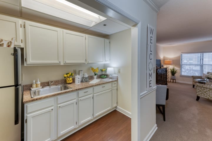 A view of a cozy kitchen with cream-colored cabinetry and modern decor.