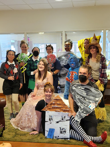 A lively group dressed in creative costumes for a themed event, showcasing their fun and festive spirit.