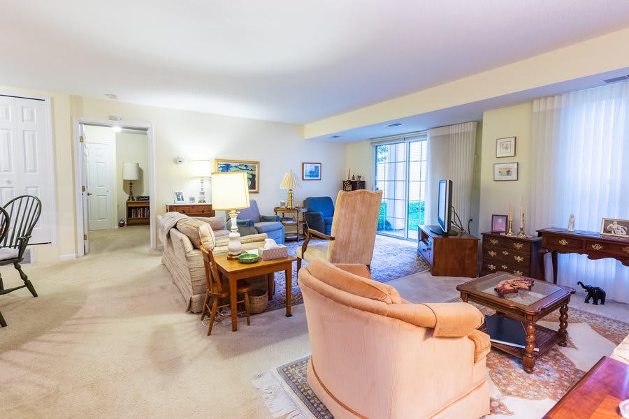 A cozy living room with comfortable seating and ambient lighting.