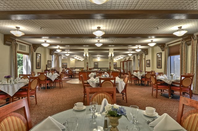 Elegant restaurant dining area with neatly arranged tables and chairs.