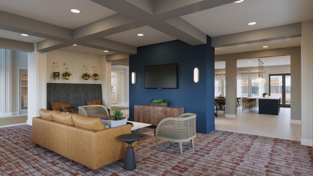 A modern living room with a blue accent wall, featuring comfortable seating and a mounted television.