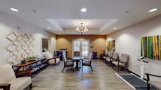 A cozy waiting area featuring comfortable chairs and a welcoming atmosphere.