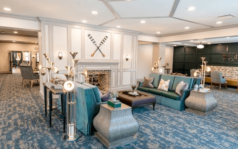 An elegantly designed living room with plush sofas, a decorative fireplace, and stylish furnishings.