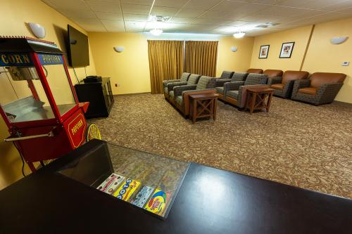 A cozy lounge area featuring comfortable seating and a television.
