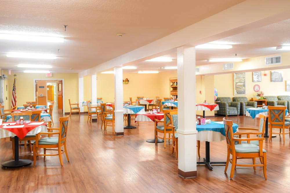 A well-lit, spacious dining area with neatly arranged tables and chairs.