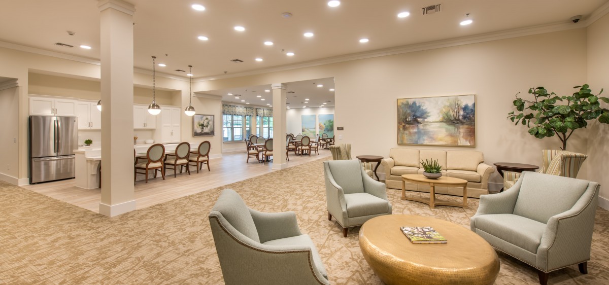 A cozy lounge area with comfortable seating and soft lighting.