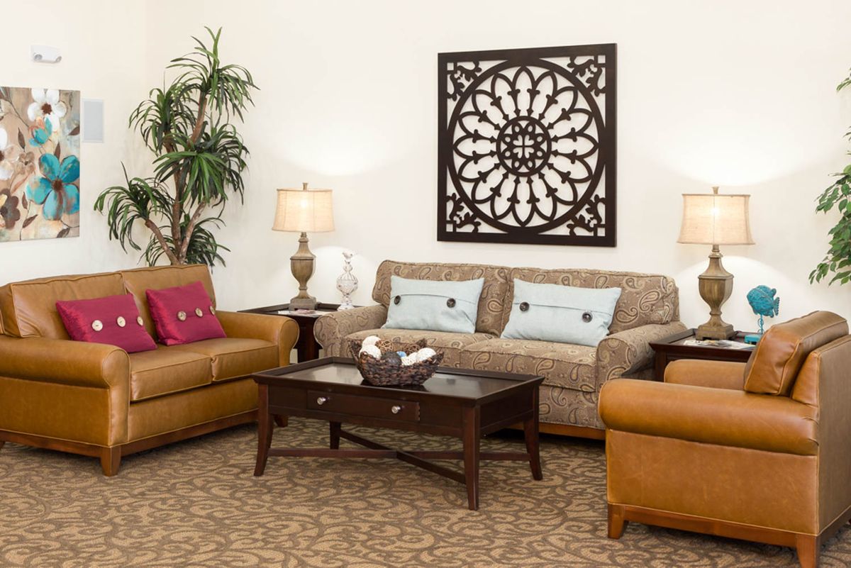 A cozy living room with comfortable seating and elegant decor.