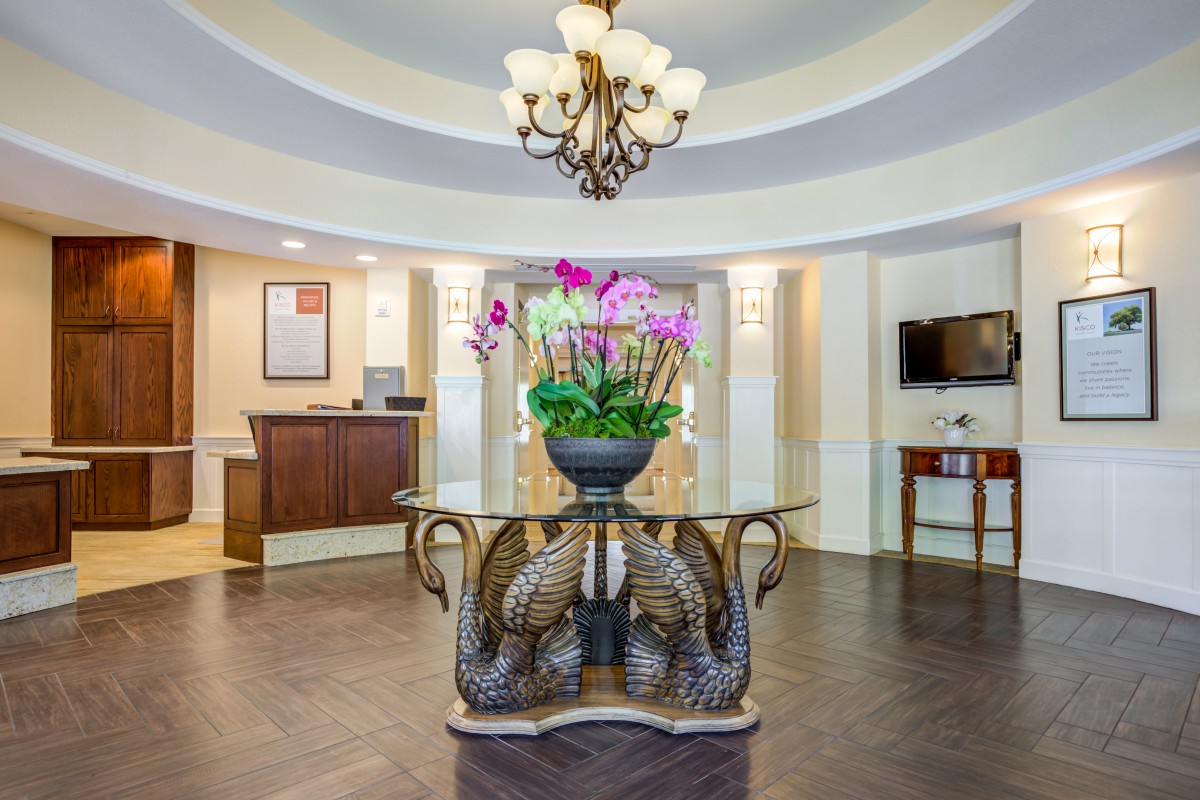 Elegant hotel lobby with a decorative centerpiece and chandelier.