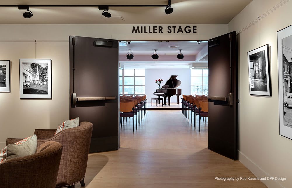 A view of the Miller Stage featuring a grand piano and audience seating.