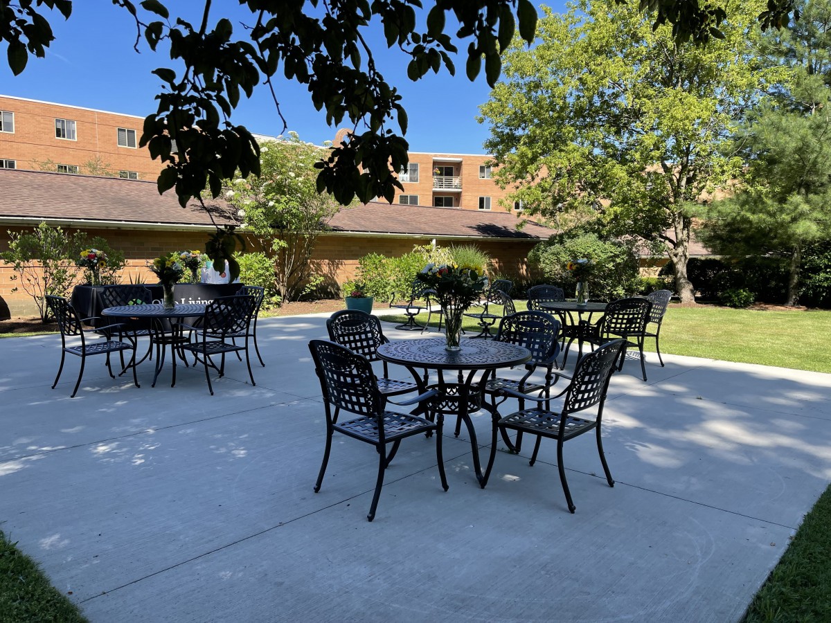 Outdoor seating area in a courtyard on a sunny day.